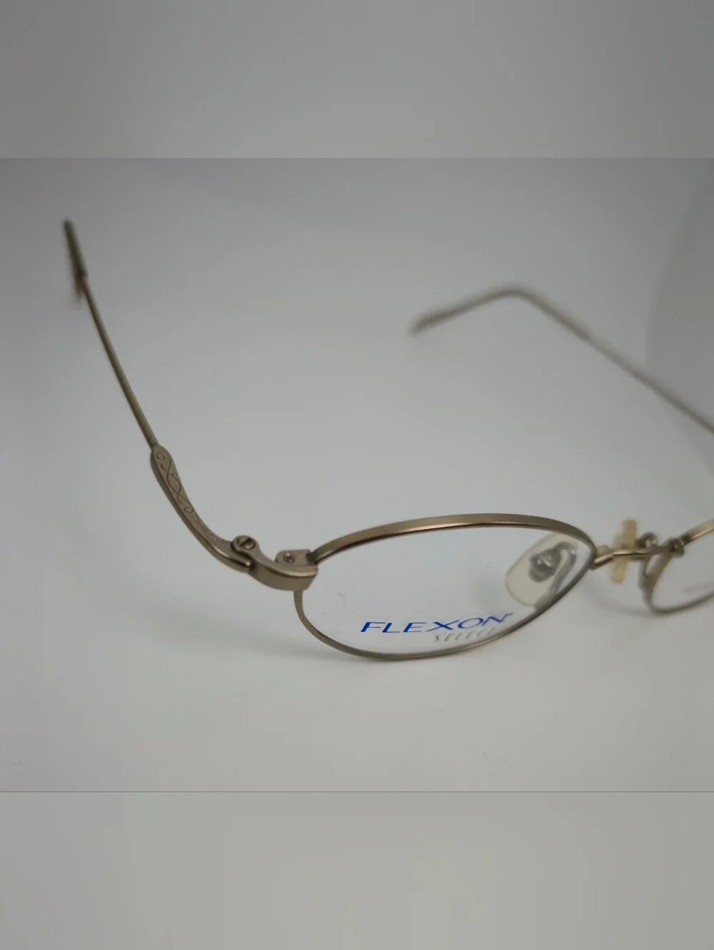 Flexon Select 1102. Women's Oval Metal Eyeglasses - Brushed Gold.